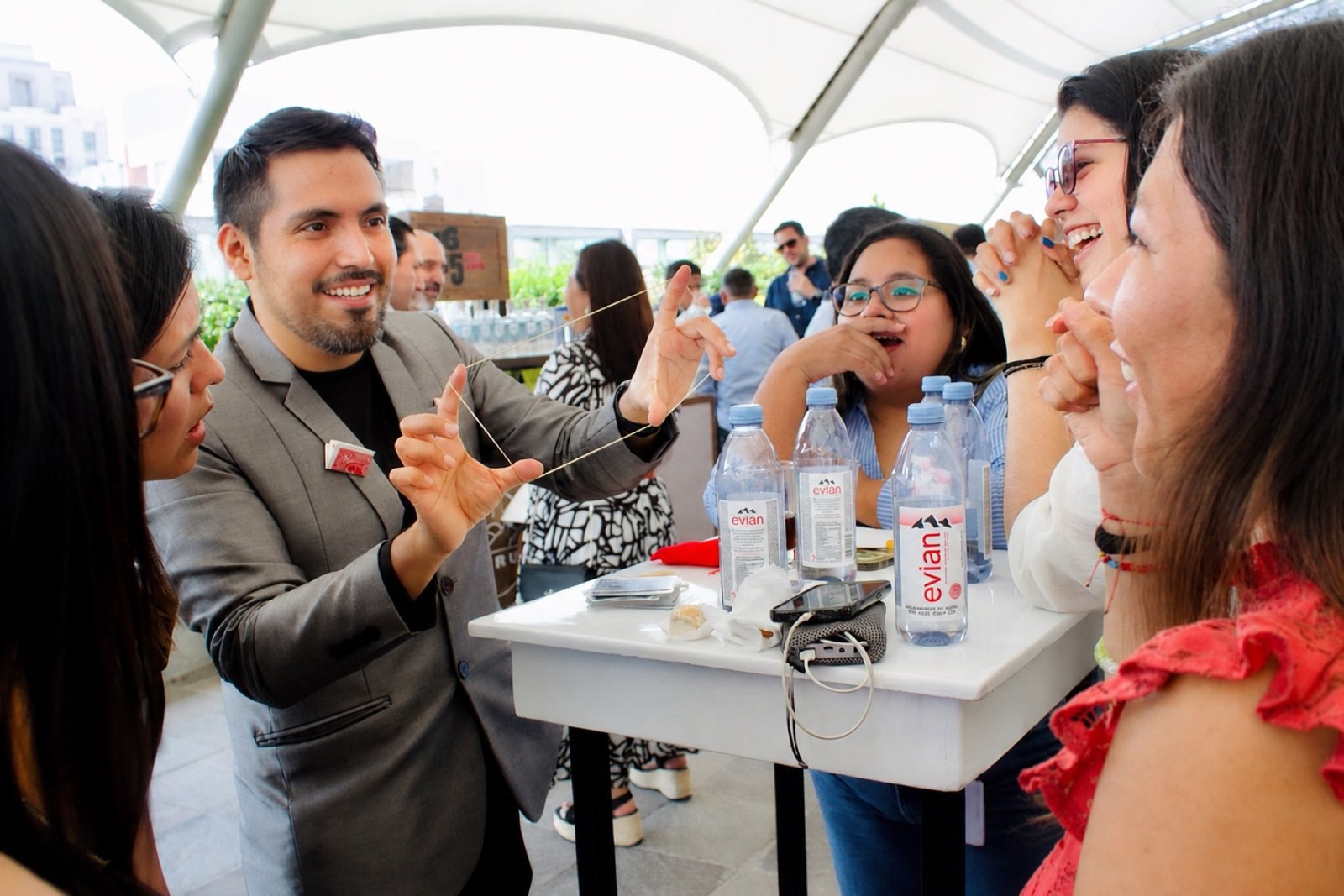 Alejandro performing close-up magic for guests